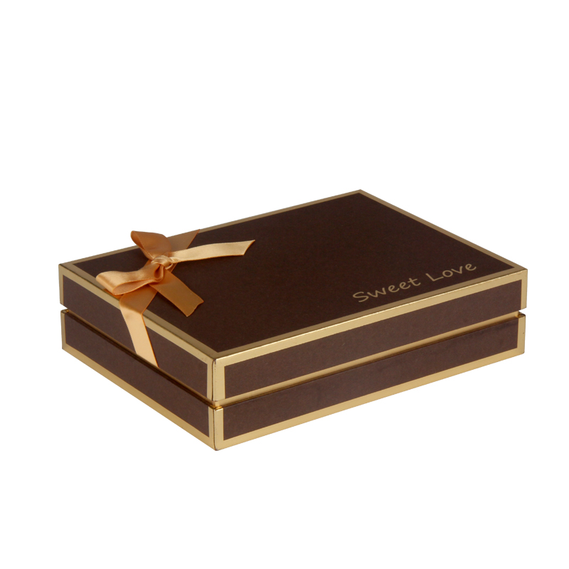 Premium chocolate packaging box with gold ribbon decoration